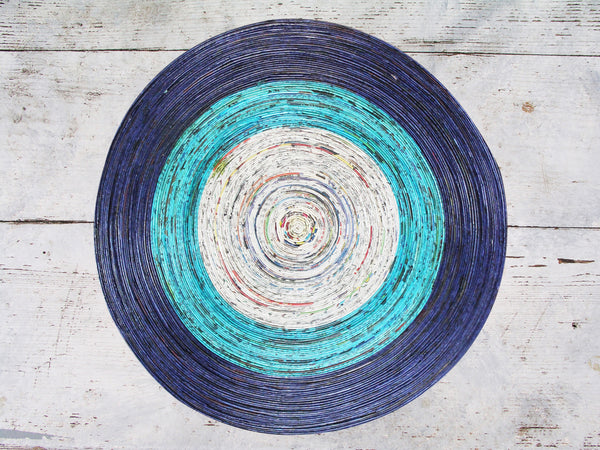 Newspaper table mat - round, large; 7 colours