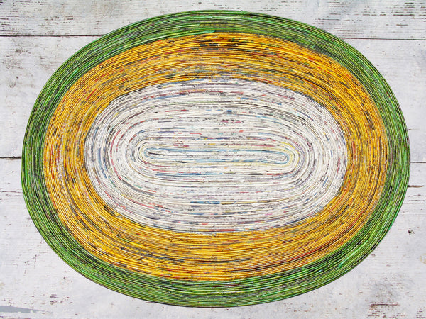 Newspaper table mat - oval, 8 colours