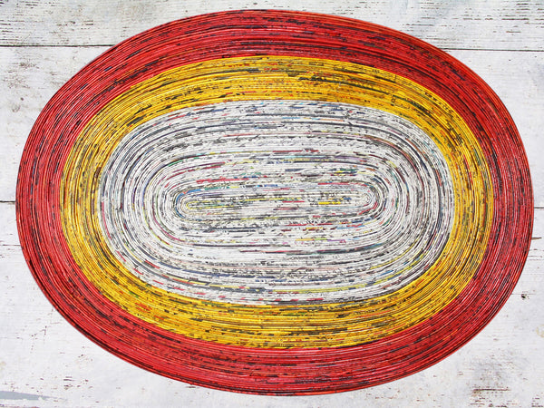 Newspaper table mat - oval, 8 colours