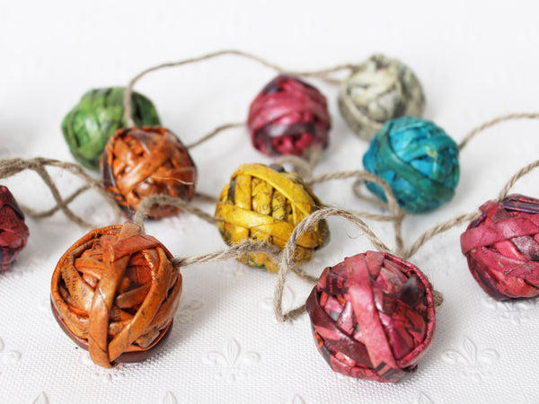 Newspaper ornaments, small - garland of 12 baubles; assorted colours